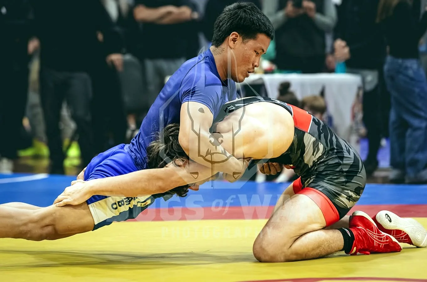 Two wrestlers contesting a takedown during competition